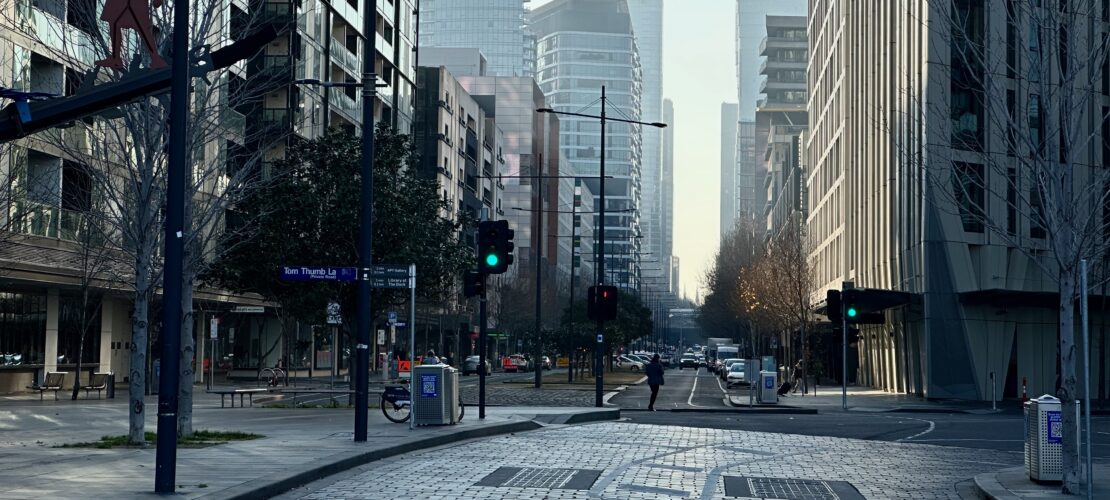 Cityscape image taken in Docklands Melbourne, of a near-empty Bourke Street.